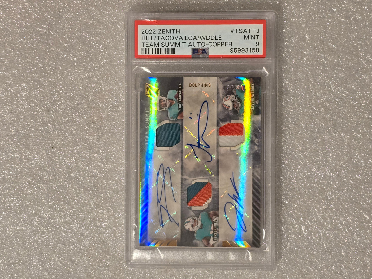 2022 Tua Tagovailoa, Tyreek Hill, Jaylen Waddle Triple Auto Jersey Card /15 PSA 9 Miami Dolphins
