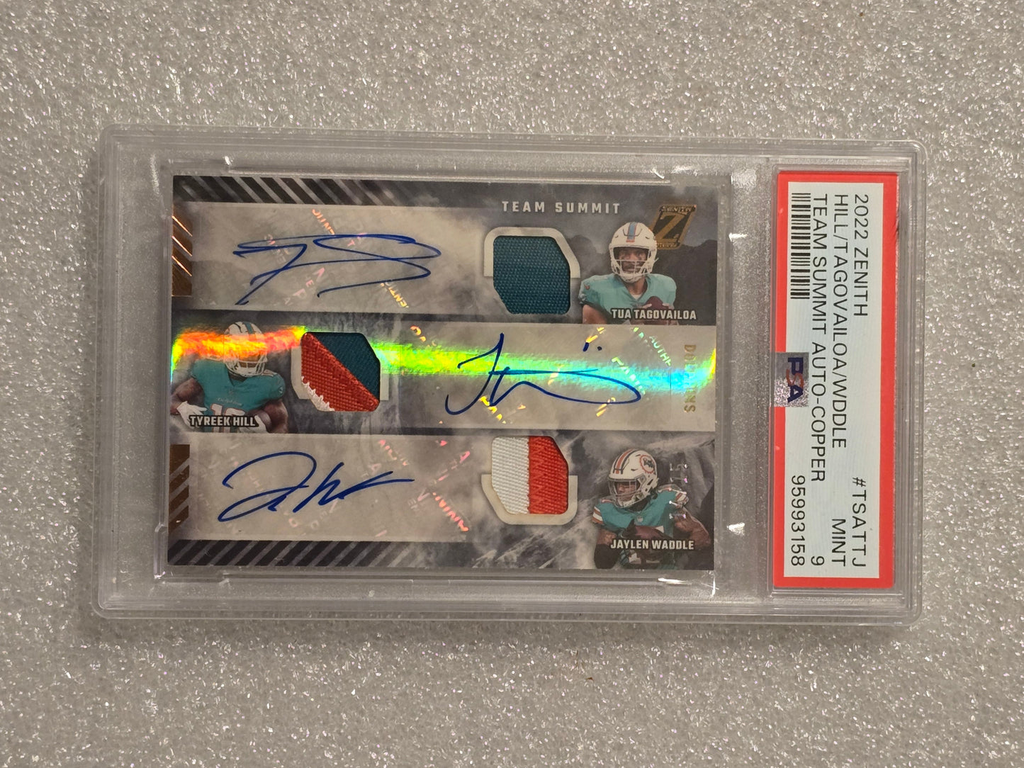 2022 Tua Tagovailoa, Tyreek Hill, Jaylen Waddle Triple Auto Jersey Card /15 PSA 9 Miami Dolphins