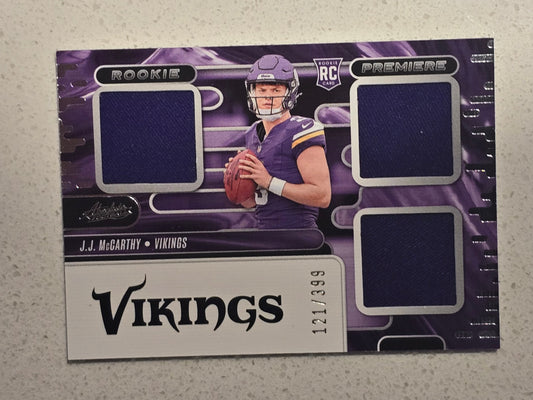 J.J. McCarthy 2024 Panini Absolute Rookie Premiere Triple Memorabilia Card